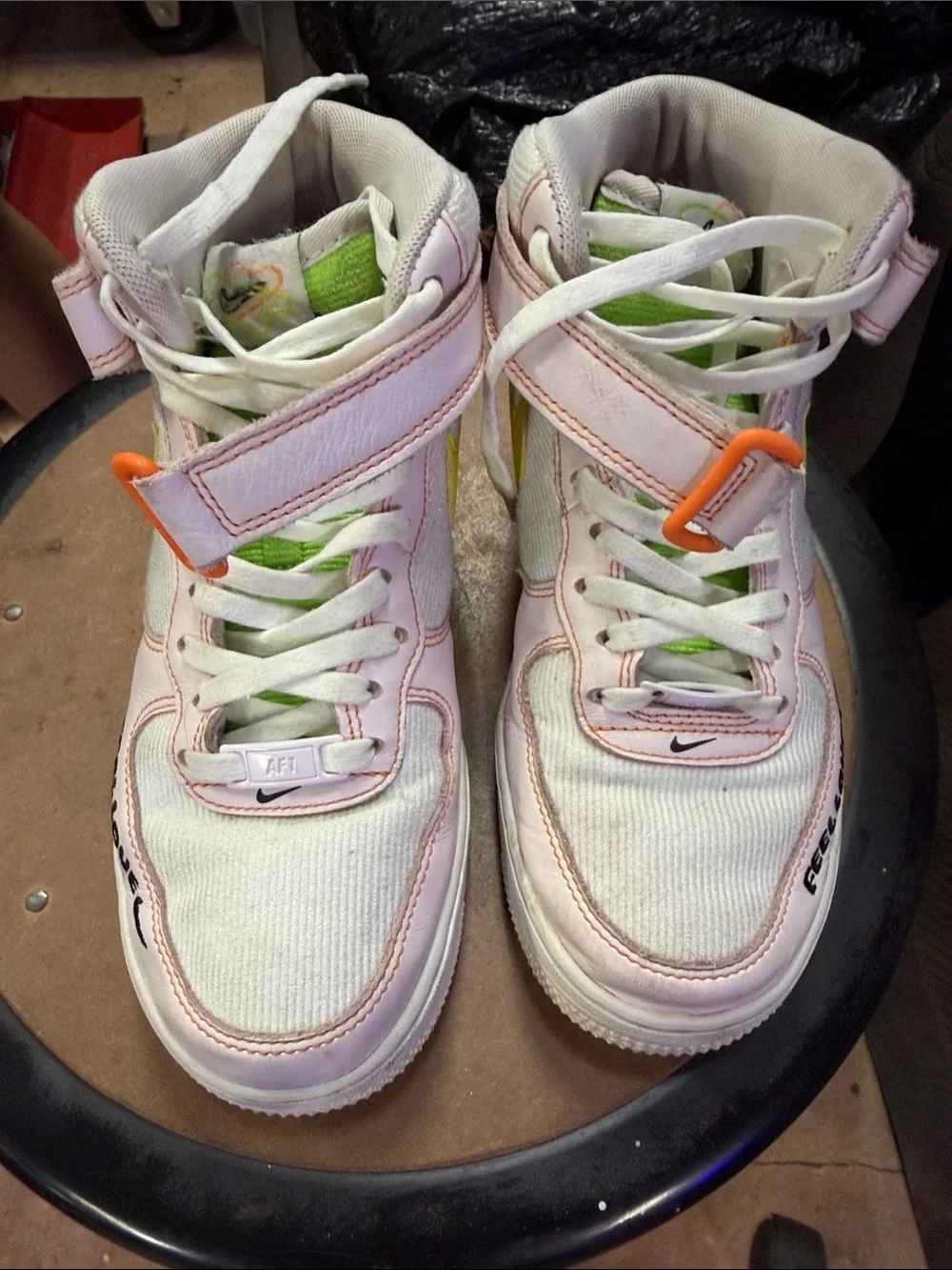 Nike women’s White and Pink High-Top Sneakers with Lime and Orange Accents